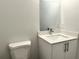 Simple bathroom with white vanity, quartz countertop and sink at 1211 Baltic Dr Dr, Poinciana, FL 34759