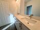 Modern bathroom with double vanity and speckled quartz countertop at 1212 Baltic Dr Way, Poinciana, FL 34759