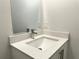 Compact bathroom sink with quartz countertop and chrome faucet at 1212 Baltic Dr Way, Poinciana, FL 34759