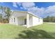 Single story home with covered patio and grassy yard at 12281 Sw 75Th St, Dunnellon, FL 34432