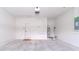 Spacious garage with white walls and a concrete floor at 12745 Sw 95Th Pl, Dunnellon, FL 34432