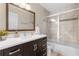 Clean bathroom with vanity, large mirror, and shower/tub combo at 13013 Quail Ct, Orlando, FL 32828