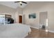 Spacious bedroom with a king-size bed, an office area, and lots of natural light at 13013 Quail Ct, Orlando, FL 32828