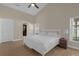 Bright bedroom with king-size bed, wood floors, and access to the backyard at 13013 Quail Ct, Orlando, FL 32828