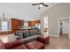 Modern kitchen with wood cabinets, an island, and stainless steel appliances at 13013 Quail Ct, Orlando, FL 32828