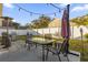 Outdoor patio with string lights, creating a relaxing ambiance at 13013 Quail Ct, Orlando, FL 32828