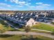 Aerial view showing townhouses and a community green space at 13715 Bressler Aly, Windermere, FL 34786