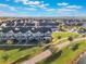 Aerial view of townhouses, community green space, and walking paths at 13715 Bressler Aly, Windermere, FL 34786