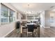 Bright dining room with a large table and modern chandelier at 13715 Bressler Aly, Windermere, FL 34786