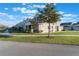 Side view of townhome showing building exterior and landscaping at 13715 Bressler Aly, Windermere, FL 34786