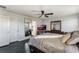 Large main bedroom with king-size bed and ensuite bathroom access at 13715 Bressler Aly, Windermere, FL 34786