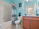 Small bathroom with teal walls and shower/tub combo at 14624 Clarkson Dr, Orlando, FL 32828