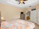 King-size bed, dresser, and ensuite bathroom access at 14624 Clarkson Dr, Orlando, FL 32828