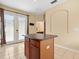 Kitchen island with dark countertop and wooden cabinets at 14624 Clarkson Dr, Orlando, FL 32828