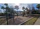 playground with swings, slides, and play structures at 14624 Clarkson Dr, Orlando, FL 32828