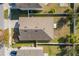 Aerial view showcasing the home's roof, fenced backyard, and proximity to neighboring houses at 1470 Silverado Flats St, Kissimmee, FL 34744