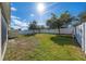 Fenced backyard with green grass and a storage shed perfect for outdoor activities at 1470 Silverado Flats St, Kissimmee, FL 34744