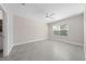 Spacious bedroom featuring tile flooring, neutral paint and a large window at 1470 Silverado Flats St, Kissimmee, FL 34744