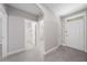 Light and airy entryway featuring neutral walls and an open doorway to other rooms at 1470 Silverado Flats St, Kissimmee, FL 34744