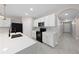 Bright kitchen with white cabinetry, black appliances, and a mosaic backsplash at 1470 Silverado Flats St, Kissimmee, FL 34744