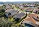 Aerial view of a residential neighborhood, showcasing homes and landscape at 15925 St Clair St, Clermont, FL 34714