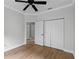 Bedroom with ceiling fan, light gray walls, and walk-in closet at 15925 St Clair St, Clermont, FL 34714