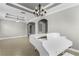 Elegant living room with a white piano and a chandelier at 15925 St Clair St, Clermont, FL 34714