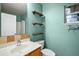 Bathroom with vanity, shelves, and shower/tub combo at 1603 S Mary St, Eustis, FL 32726