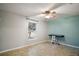 Bedroom with tiled floors, window, ceiling fan and neutral decor at 1603 S Mary St, Eustis, FL 32726