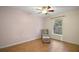 Bright bedroom with tiled floors and a ceiling fan at 1603 S Mary St, Eustis, FL 32726