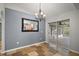 Dining room with tiled floors, sliding doors to patio, and chandelier at 1603 S Mary St, Eustis, FL 32726