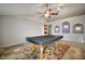 Game room with a pool table, ceiling fan, and tiled floors at 1603 S Mary St, Eustis, FL 32726