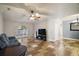 Living room with gray couch, large window, and tiled floors at 1603 S Mary St, Eustis, FL 32726