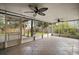 Spacious screened porch with tile floor and ceiling fans at 1603 S Mary St, Eustis, FL 32726