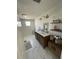 Modern bathroom with double sink vanity, marble floors and modern finishes at 1705 Underwood Ave, St Cloud, FL 34771