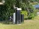 Water filtration system set up in the back yard with surrounding lush landscaping at 1705 Underwood Ave, St Cloud, FL 34771