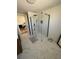 Primary bathroom with frameless glass shower and modern fixtures at 1705 Underwood Ave, St Cloud, FL 34771