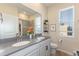 Clean bathroom with double vanity and gray countertop at 1860 Black Maple Pl, Ocoee, FL 34761