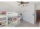 ' bedroom with bunk bed and ample closet space at 1860 Black Maple Pl, Ocoee, FL 34761