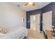 Bedroom with a full-size bed and access to a hallway at 1860 Black Maple Pl, Ocoee, FL 34761