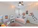 Charming bedroom with a daybed and artistic wall decor at 1860 Black Maple Pl, Ocoee, FL 34761