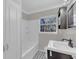 Bright bathroom featuring a shower-tub combo, tiled floors, and a vanity with a sink at 2106 Cordova Dr, Sanford, FL 32771
