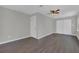 Spacious bedroom with neutral walls, ceiling fan, hardwood floors and closet at 2106 Cordova Dr, Sanford, FL 32771