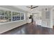 Bright dining area with hardwood floors and a view into the kitchen with stainless appliances at 2106 Cordova Dr, Sanford, FL 32771