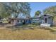 Charming single-story home with a well-manicured lawn and inviting curb appeal at 2106 Cordova Dr, Sanford, FL 32771