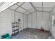 Interior view of the storage shed showing shelving and concrete block floor at 2106 Cordova Dr, Sanford, FL 32771