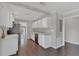 Modern kitchen with white cabinets, stainless steel appliances, and granite countertops at 2106 Cordova Dr, Sanford, FL 32771