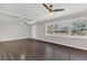 Open living space with hardwood floors, ceiling fan, and bright natural light at 2106 Cordova Dr, Sanford, FL 32771