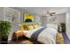 Staged bedroom with a decorative rug, modern artwork, and natural light at 2106 Cordova Dr, Sanford, FL 32771