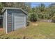 Outdoor shot of backyard featuring a storage shed and fire pit at 2106 Cordova Dr, Sanford, FL 32771